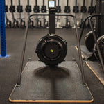 Concept2 Ski Erg with the Equip Wider Base in a gym setting on a black floor