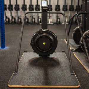 Concept2 Ski Erg with the Equip Wider Base in a gym setting on a black floor